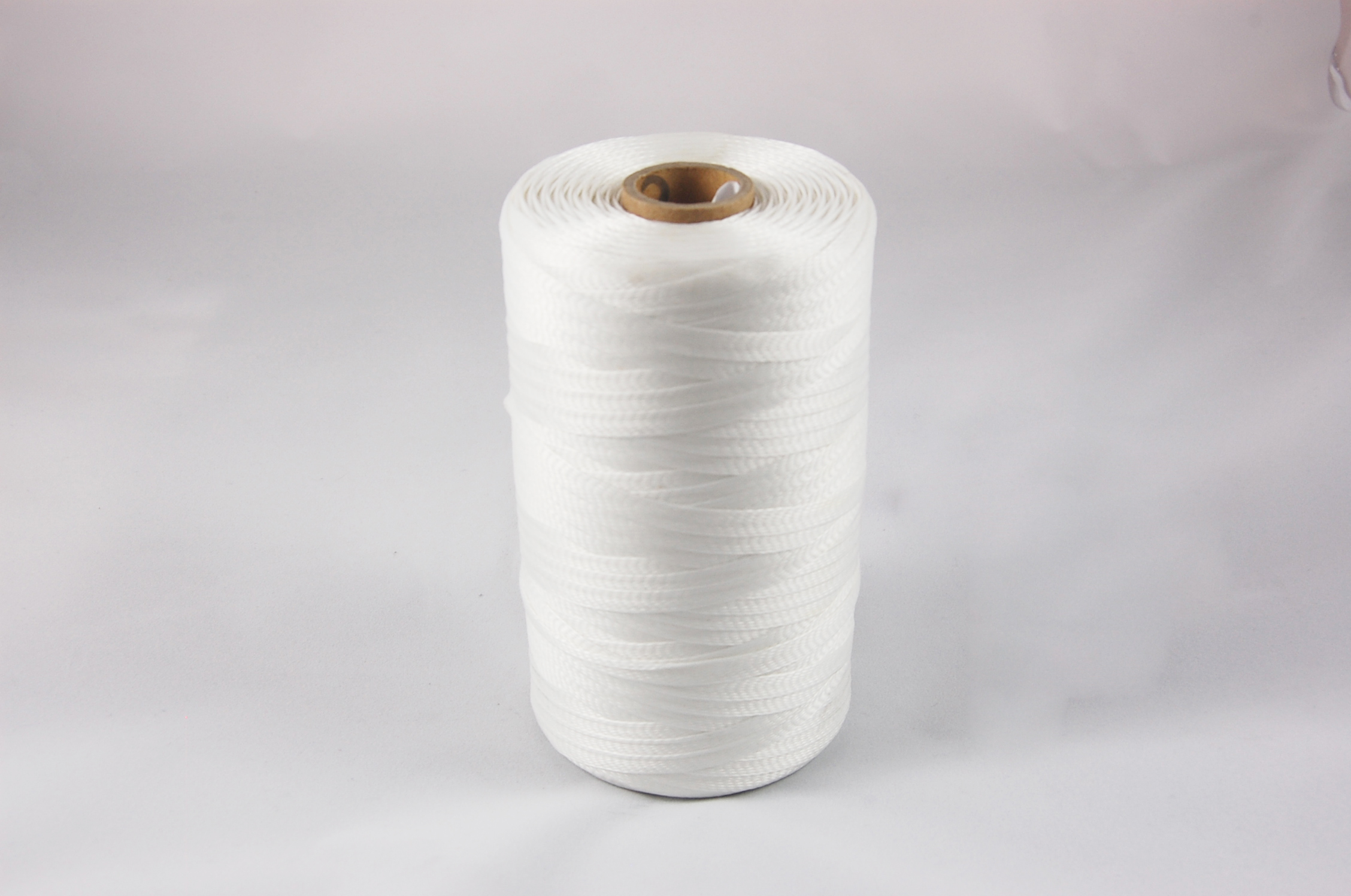 100LS .100" DPS-2 .012" thick Treated Low-Shrink Flat Braided Heat Shrinkable Polyester Tape 155°C, natural, .100" wide x  250 YD spool